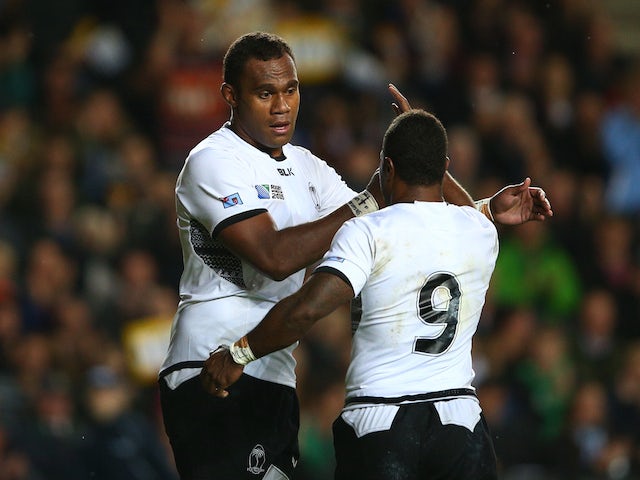 Leone Nakarawa of Fiji (L) celebrates with Nemia Kenatale as he scores their fourth try during the 2015 Rugby World Cup Pool A match between Fiji and Uruguay at Stadium mk on October 6, 2015 in Milton Keynes, United Kingdom.
