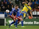 Swedens forward Zlatan Ibrahimovic (R) vies with Liechtensteins defenders Sandro Wieser and Yves Oehri during the Euro 2016 Group G qualifying football match between Liechtenstein and Sweden at the Rheinpark stadium in Vaduz on October 9, 2015. 