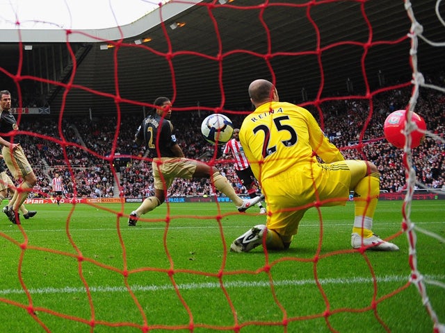 Darren Bent of Sunderland watches as his shot goes between Glen Johnson and Pepe Reina of Liverpool and in to the goal off of a balloon, during the Barclays Premier League match between Sunderland and Liverpool at the Stadium of Light on October 17, 2009