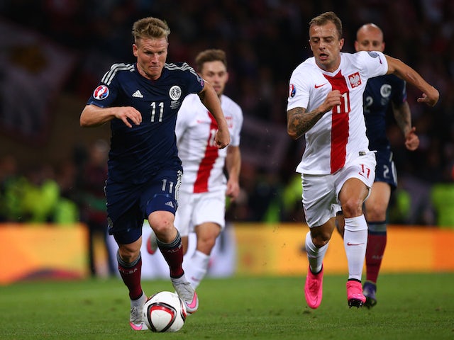 Matt Ritchie of Scotland takes on Kamil Grosicki of Poland during the EURO 2016 Qualifier between Scotland and Poland at Hamden Park on October 8, 2015 in Glasgow, Scotland. 