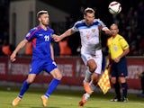 Russia's defender Aleksei Berezutski (R) vies Moldova's forward Nicolae Milinceanu during the Euro 2016 qualifying football match between Russia and Moldova at the Stadionul Zimbru in Chisinau on October 9, 2015.