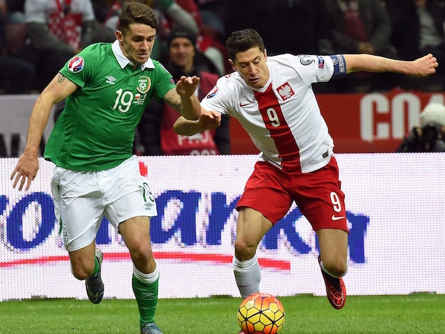 Ireland's midfielder Robbie Brady (L) and Polish striker Robert Lewandowski vie during the Euro 2016 Group D qualifying football match between Poland and the Republic of Ireland at the Stadion Narodowy in Warsaw on October 11, 2015. 