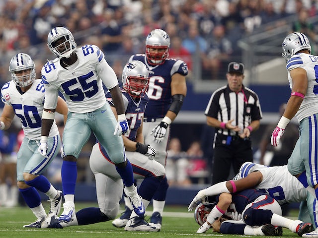 Middle linebacker Rolando McClain #55 of the Dallas Cowboys celebrates a sack against quarterback Tom Brady #12 of the New England Patriots in the first quarter at AT&T Stadium on October 11, 2015 in Arlington, Texas.