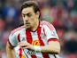 Sebastian Coates of Sunderland and Diafra Sakho of West Ham United compete for the ball during the Barclays Premier League match between Sunderland and West Ham United at the Stadium of Light in Sunderland, United Kingdom