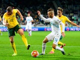 Slovenia's Dejan Lazarevic (C) vies with Lithuania's Georgas Freidgeimas (L) during the Euro 2016 Group E qualifying football match between Slovenia and Lithuania at the Stozice stadium in Ljubljana, Slovenia on October 9, 2015.