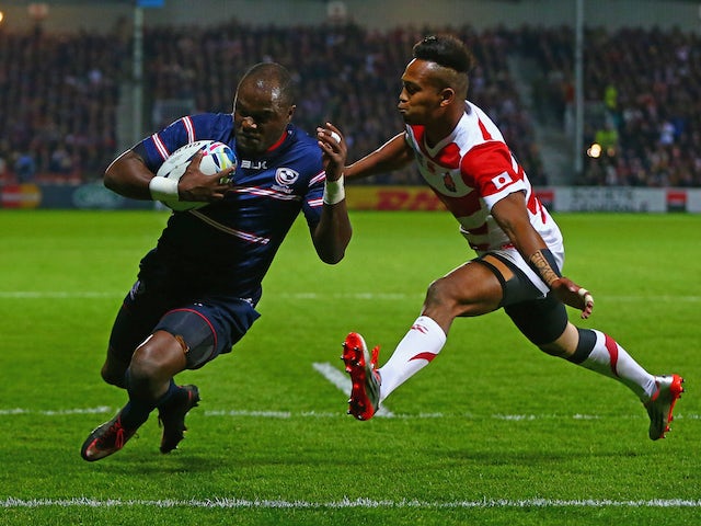 Takudzwa Ngwenya of the United States scores their first try under pressure from Kotaro Matsushima of Japan during the 2015 Rugby World Cup Pool B match between USA and Japan at Kingsholm Stadium on October 11, 2015 in Gloucester, United Kingdom.