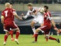 Germany's midfielder Thomas Mueller (C) and Georgia's defender Solomon Kverkvelia (R) vie for the ball during the Euro 2016 Group D qualifying football match between Germany and Georgia in Leipzig, eastern Germany, on October 11, 2015.