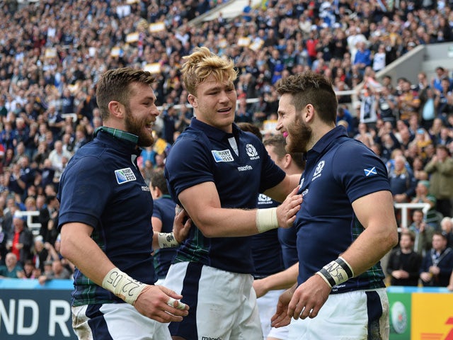 Scotland's wing Tommy Seymour (R) celebrates with teammates after scoring his team's first try during a Pool B match of the 2015 Rugby World Cup between Scotland and Samoa at St James' Park in Newcastle-upon-Tyne, northeast England, on October 10, 2015