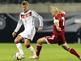 Georgia's midfielder Jaba Kankava (R) and Germany's midfielder Toni Kroos vie for the ball during the Euro 2016 Group D qualifying football match between Germany and Georgia in Leipzig, eastern Germany, on October 11, 2015. 