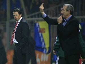Head coach Chris Coleman (L) of Wales looks at head coach Mehmed Bazdarevic (R) of Bosnia during the Euro 2016 qualifying football match between Bosnia and Herzegovina and Wales at the Stadium Bilino Polje in Elbasan on October 10, 2015.