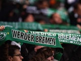 Bremen's fans wave with scarves prior to the German first division Bundesliga football match SV Werder Bremen vs VfL Wolfsburg in Bremen, western Germany, on March 1, 2015.