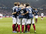 France's midfielder Yohan Cabaye (C) celebrates with teammates after scoring a goal during the friendly football match between France and Armenia on October 8, 2015 at the Allianz Riviera stadium in Nice, southeastern France.