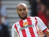 Younes Kaboul of Sunderland clears the ball from Harry Kane of Tottenham Hotspur during the Barclays Premier League match between Sunderland and Tottenham Hotspur at the Stadium of Light on September 13, 2015 in Sunderland, United Kingdom.