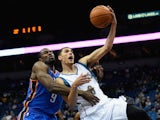 Zach LaVine #8 of the Minnesota Timberwolves shoots the ball as Serge Ibaka #9 of the Oklahoma City Thunder reaches over for a foul during the third quarter of the preseason game on October 7, 2015 at Target Center in Minneapolis, Minnesota. 