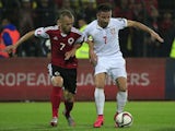 Zoran Tosic (R) of Serbia in action against Ansi Agolli (L) of Albania during the UEFA EURO 2016 qualifier between Albania and Serbia at the Elbasan Arena on October 08, 2015 in Elbasan, Albania .