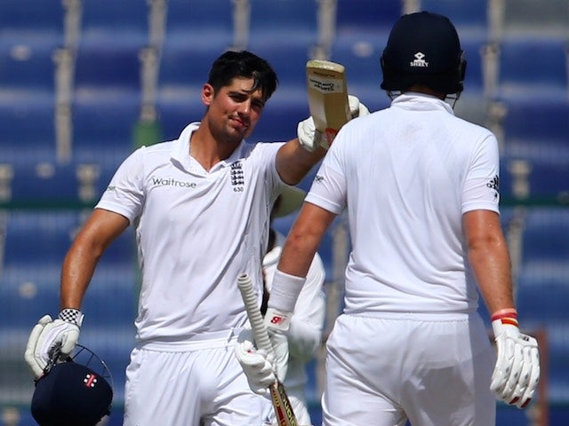 England captain Alastair Cook celebrates reaching 200 runs on day four of the first Test against Pakistan in Abu Dhabi on October 16, 2015