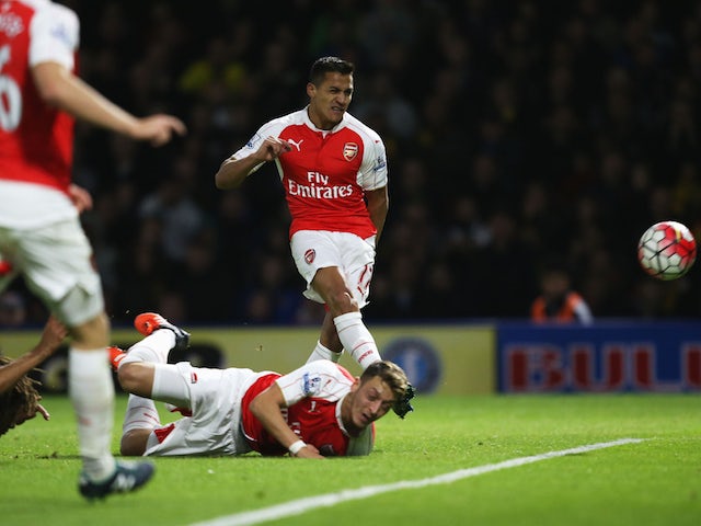 Alexis Sanchez of Arsenal scores their first goal during the Barclays Premier League match between Watford and Arsenal at Vicarage Road on October 17, 2015 in Watford, England. 