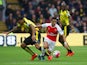 Alexis Sanchez of Arsenal and Troy Deeney of Watford compete for the ball during the Barclays Premier League match between Watford and Arsenal at Vicarage Road on October 17, 2015 in Watford, England. 