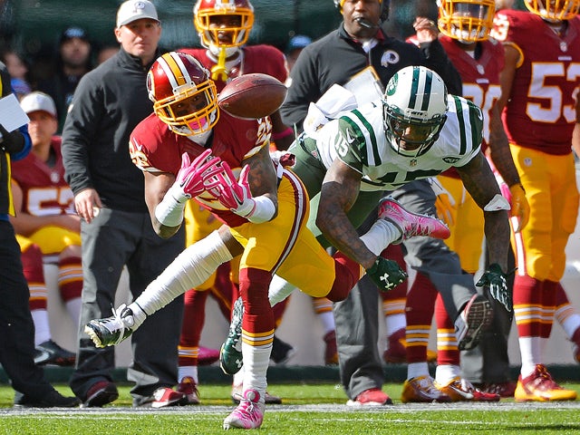 Bashaud Breeland #26 of the Washington Redskins intercepts a pass intended for Brandon Marshall #15 of the New York Jets during the second quarter at MetLife Stadium on October 18, 2015