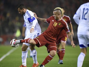 Belgium score three to ease past Israel