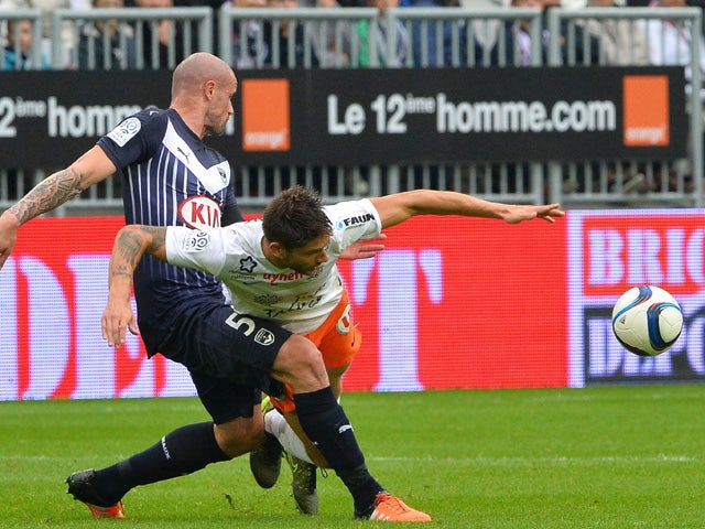 Bordeaux's French defender Nicolas Pallois (L) vies with Montpellier's French midfielder Paul Lasne during the French L1 football match Bordeaux vs Montpellier on october 18, 2015