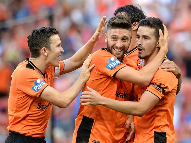 Brandon Borrello of the Roar is congratulated by team mates Matt McKay (L) and Jamie Maclaren (R) after scoring a goal during the round two A-League match between the Brisbane Roar and Central Coast Mariners at Suncorp Stadium on October 18, 2015