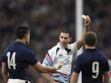Scotland's wing Sean Maitland (L) receives a yellow card from South African Craig Joubert (C) during a quarter final match of the 2015 Rugby World Cup between Australia and Scotland at Twickenham stadium, southwest London on October 18, 2015
