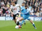 Jack Price of Wolverhampton Wanderers FC puts pressure on Jeff Hendrick of Derby County FC in a tackle during the Sky Bet Championship match between Derby County and Wolverhampton Wanderers at Pride Park Stadium on October 18, 2015 in Derby, England.