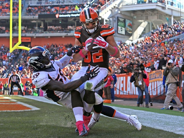 Tight end Gary Barnidge #82 of the Cleveland Browns catches a pass for a touchdown while being defended by inside linebacker Danny Trevathan #59 of the Denver Broncos during the third quarter at Cleveland Browns Stadium on October 18, 2015