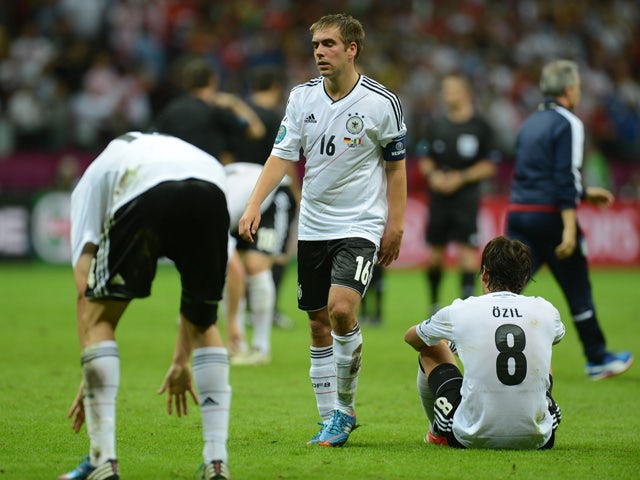 German defender Philipp Lahm (C) reacts at the end of the Euro 2012 football championships semi-final match Germany vs Italy on June 28, 2012