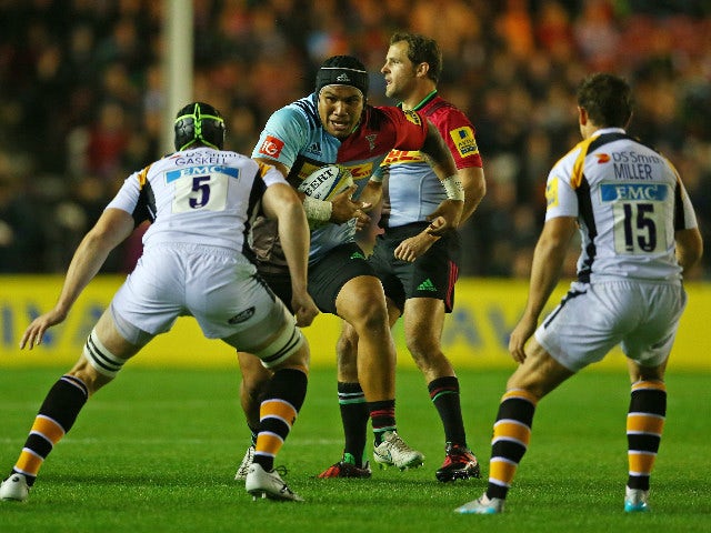 Mat Luamanu of Harlequins takes on the Wasps defence during the Aviva Premiership match between Harlequins and Wasps at Twickenham Stoop on October 16, 2015 in London, England.
