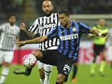 Jeison Murillo of FC Internazionale Milano competes for the ball with Simone Zaza (back) of Juventus FC during the Serie A match between FC Internazionale Milano and Juventus FC at Stadio Giuseppe Meazza on October 18, 2015