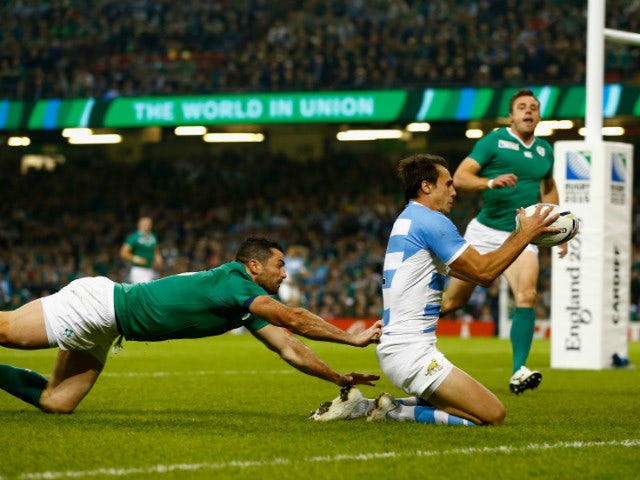 Ireland fullback Rob Kearney (l) fails to stop Juan Imhoff of Aargentina scoring the second try during the 2015 Rugby World Cup Quarter Final match between Ireland and Argentina at Millennium Stadium on October 18, 2015 in Cardiff, United Kingdom.