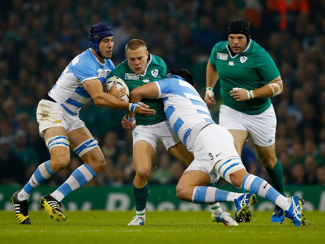 Ian Madigan of Ireland is tackled by Ramiro Herrera of Argentina during the 2015 Rugby World Cup Quarter Final match between Ireland and Argentina at the Millennium Stadium on October 18, 2015 in Cardiff, United Kingdom.
