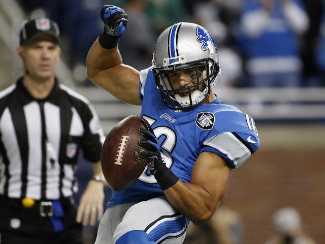 Lance Moore #16 of the Detroit Lions celebrates a first quarter touchdown against the Chicago Bears at Ford Field on October 18, 2015