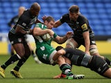 Jebb Sinclair of London Irish is tackled by Seremaia Bai (L), Mike Williams (R) and Mike Fitzgerald of Leicester during the Aviva Premiership match between London Irish and Leicester Tigers at Madejski Stadium on October 18, 2015