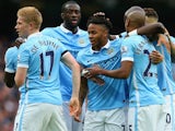 Raheem Sterling of Manchester City celebrates scoring his team's first goal with his team mates during the Barclays Premier League match between Manchester City and A.F.C. Bournemouth at Etihad Stadium on October 17, 2015