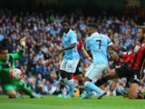 Raheem Sterling of Manchester City scores his team's first goal during the Barclays Premier League match between Manchester City and A.F.C. Bournemouth at Etihad Stadium on October 17, 2015
