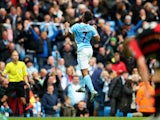 Raheem Sterling of Manchester City celebrates scoring his team's fourth and hat trick goal during the Barclays Premier League match between Manchester City and A.F.C. Bournemouth at Etihad Stadium on October 17, 2015
