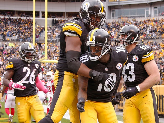 Marcus Gilbert #77 and Martavis Bryant #10 of the Pittsburgh Steelers celebrate Bryant's a 3rd quarter touchdown during the game against the Arizona Cardinals at Heinz Field on October 18, 2015