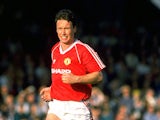 Mike Duxbury of Manchester United keeps an eye on the ball during a match against Wimbledon at Plough Lane in London