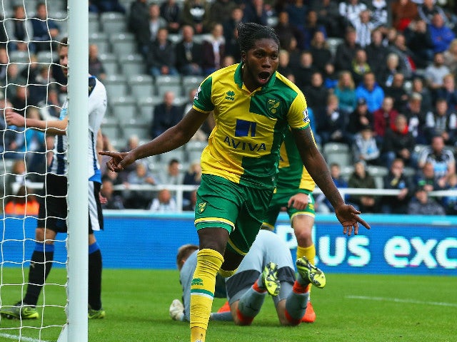 Dieumerci Mbokani of Norwich City celebrates as he scores their first and equalising goal during the Barclays Premier League match between Newcastle United and Norwich City at St James' Park on October 18, 2015 in Newcastle upon Tyne, England.