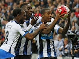 Newcastle United's Dutch midfielder Georginio Wijnaldum (R) celebrates with Newcastle United's Dutch midfielder Vurnon Anita (L) and Newcastle United's French defender Massadio Haidara (2nd L) after scoring his fourth goal, Newcastle's sixth, during the E