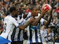 Newcastle United's Dutch midfielder Georginio Wijnaldum (R) celebrates with Newcastle United's Dutch midfielder Vurnon Anita (L) and Newcastle United's French defender Massadio Haidara (2nd L) after scoring his fourth goal, Newcastle's sixth, during the E