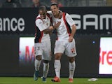 Nice's French forward Hatem Ben Arfa (R) celebrates with his teammate Nice's Portuguese defender Ricardo Pereira after scoring a goal during the French L1 football match between Rennes and Nice on October 18, 2015