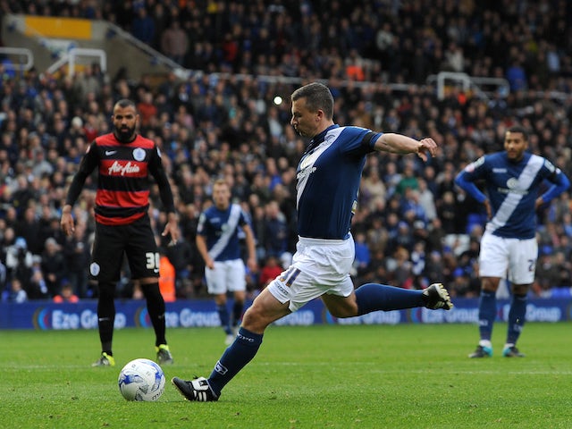 Paul Caddis of Birmingham City scores his sides second goal during the Sky Bet Championship match between Birmingham City and Queens Park Rangers at St Andrews on October 17, 2015 in Birmingham, England.