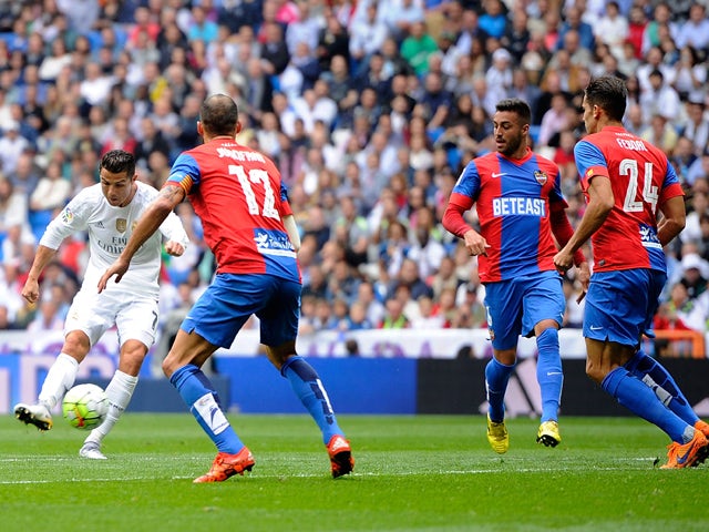 Cristiano Ronaldo of Real Madrid scores Real's 2nd goal during the La Liga match between Real Madrid CF and Levante UD at estadio Santiago Bernabeu on October 17, 2015