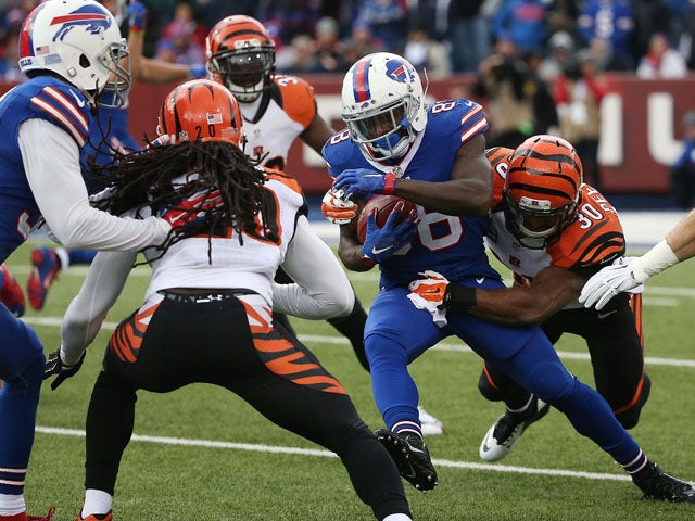 Ronald Darby #28 of the Buffalo Bills is takled by Cedric Peerman #30 of the Cincinnati Bengals during the first half at Ralph Wilson Stadium on October 18, 2015