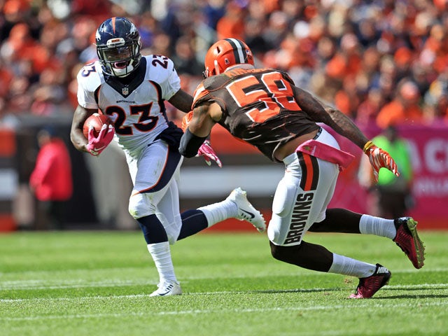Running back Ronnie Hillman #23 of the Denver Broncos runs the ball during the first quarter towards inside linebacker Chris Kirksey #58 of the Cleveland Browns at Cleveland Browns Stadium on October 18, 2015