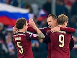 Russia's midfielder Pavel Mamaev, Russia's defender Sergei Ignashevich and Russia's forward Aleksandr Kokorin celebrate their victory over Montenegro after the UEFA Euro 2016 group G qualifying football match between Russia and Montenegro at the Otkrytie 